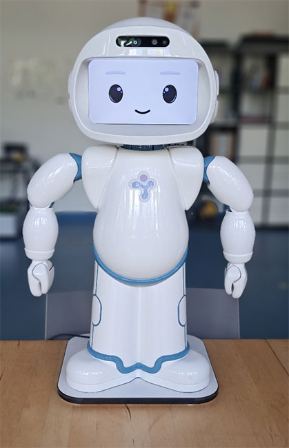 Ein weißer humanoider Roboter mit freundlichem Gesicht